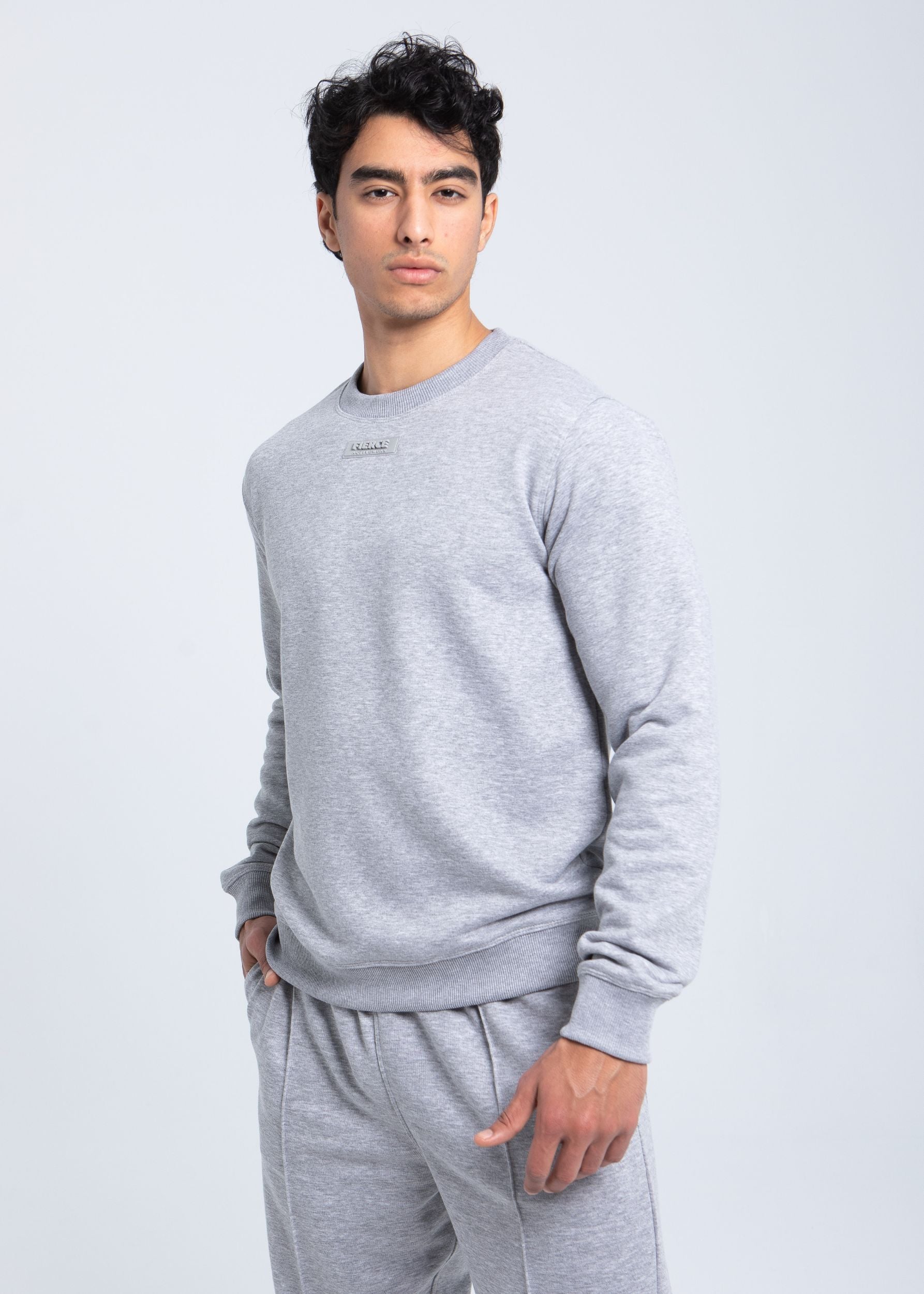 Side view of fleece crewneck showing clean silhouette