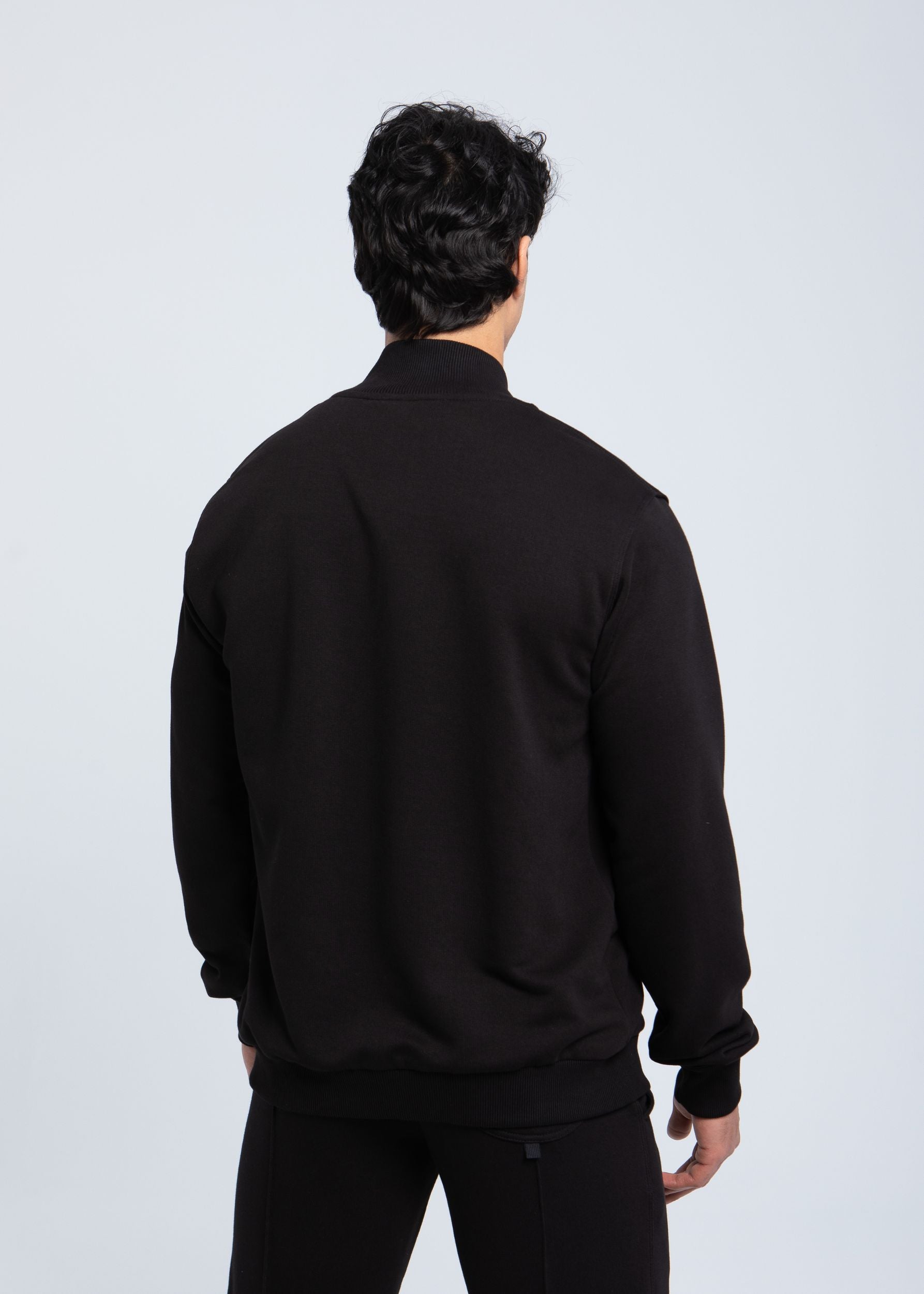 Essential full-zip sweatshirt back view showing clean structure