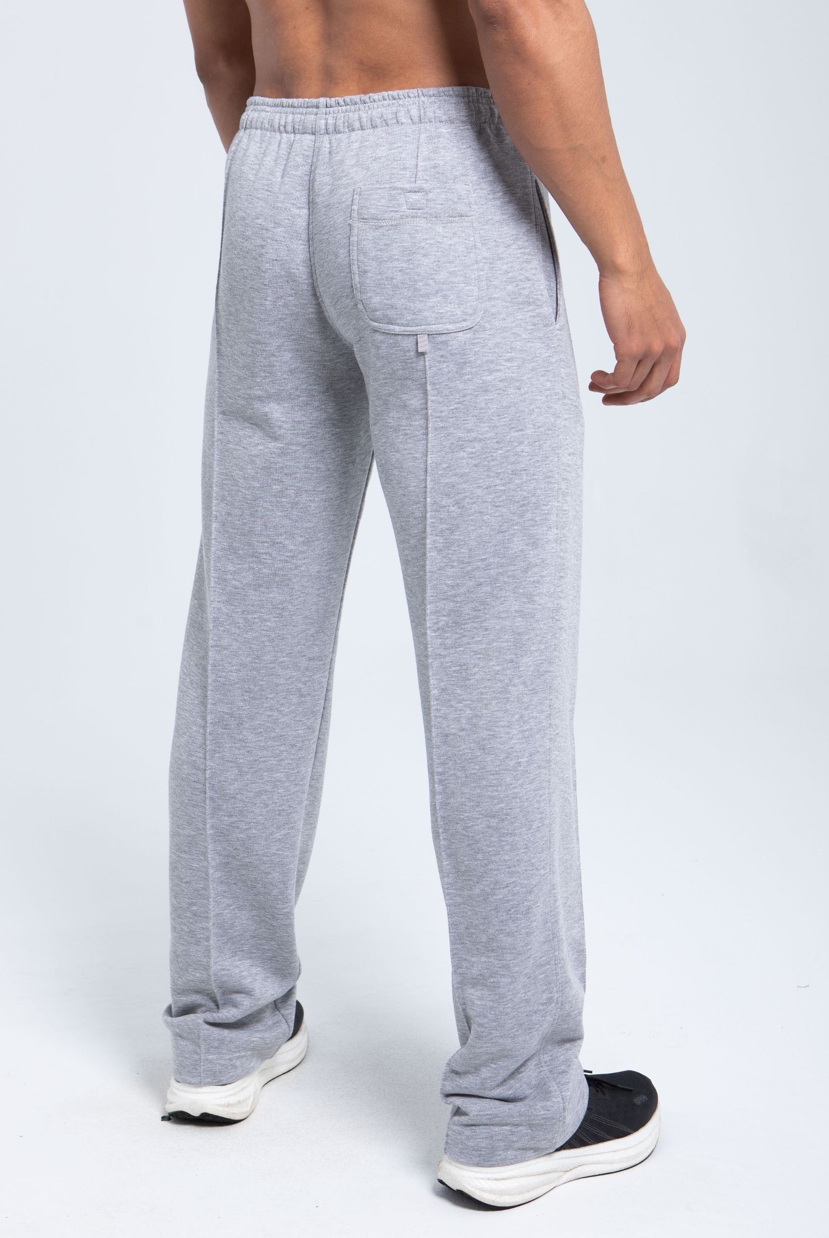 Back view of fleece pants with patch pocket and clean branding