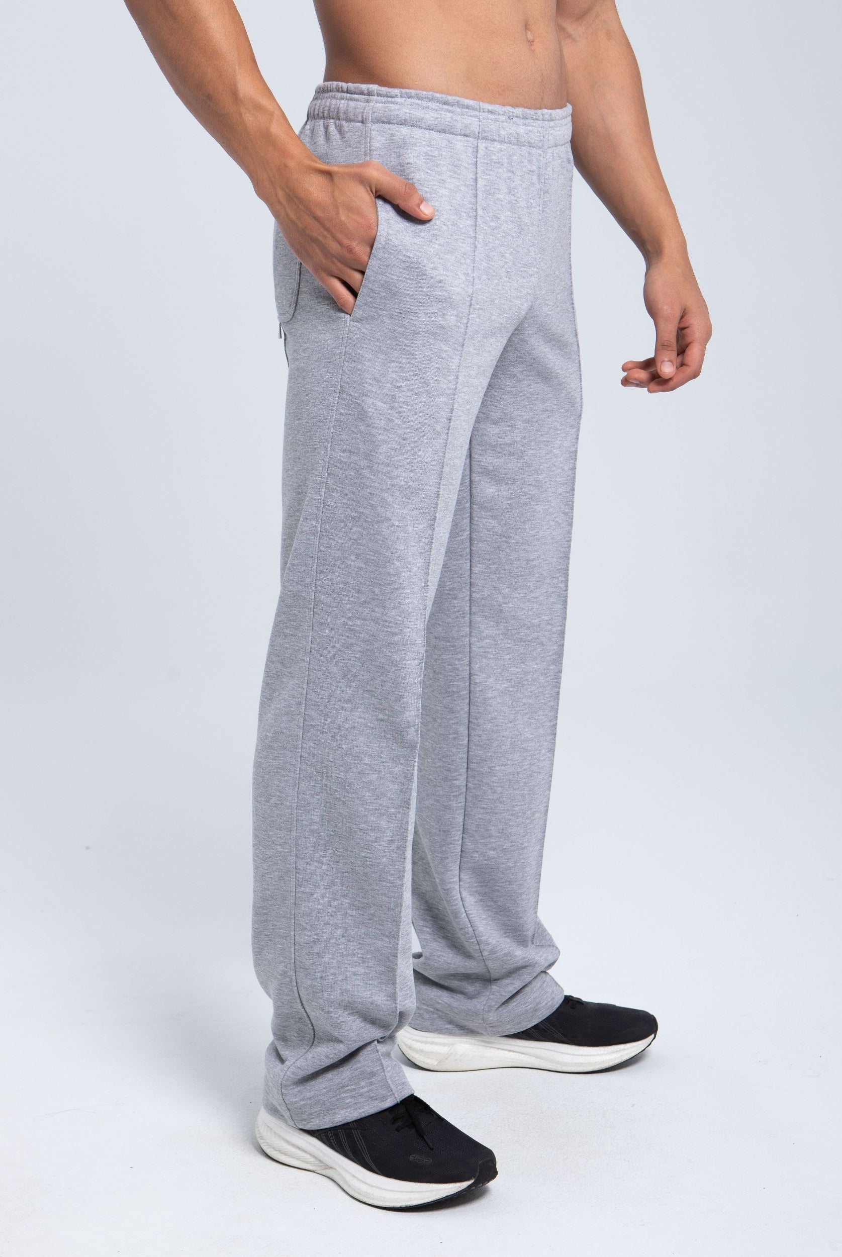 Angled side view of pleated fleece pants with elastic waistband