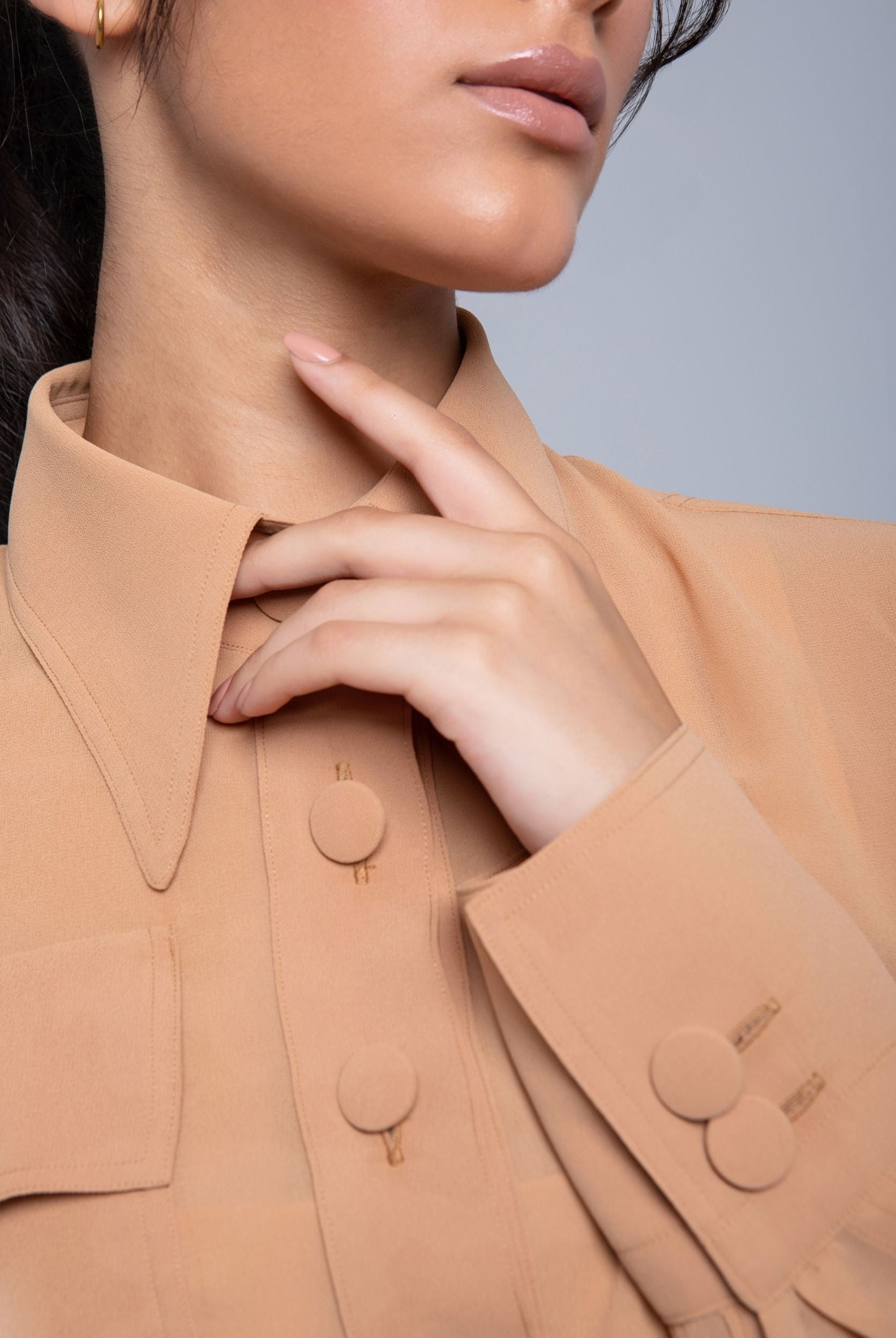 Sheer Jacket with button front, sleeve slits, and gold-accented belt