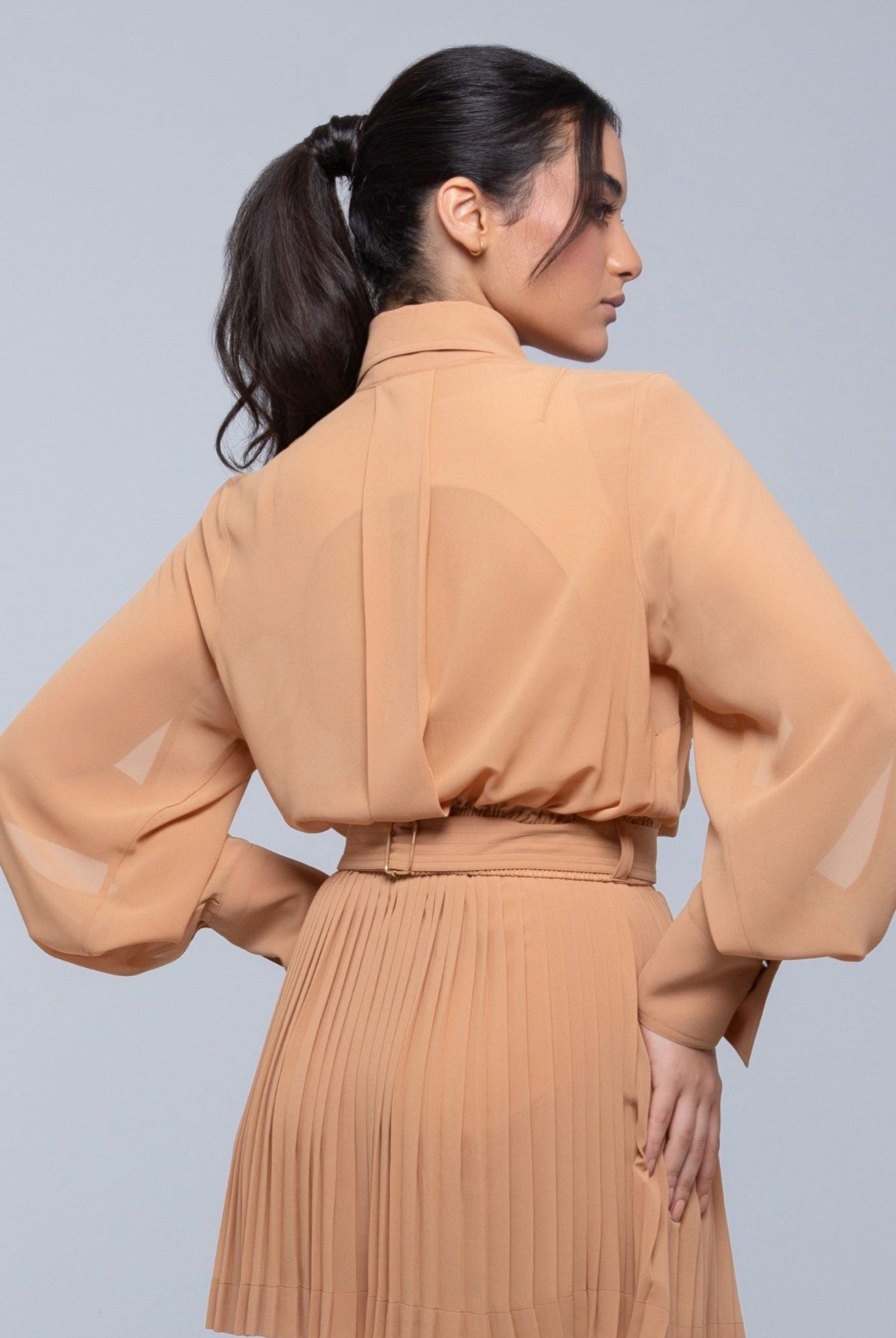 Sheer Jacket with button front, sleeve slits, and gold-accented belt