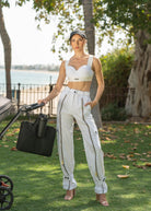 Street-style cargo pants with ankle belts and front zip closure
