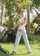 Street-style cargo pants with ankle belts and front zip closure