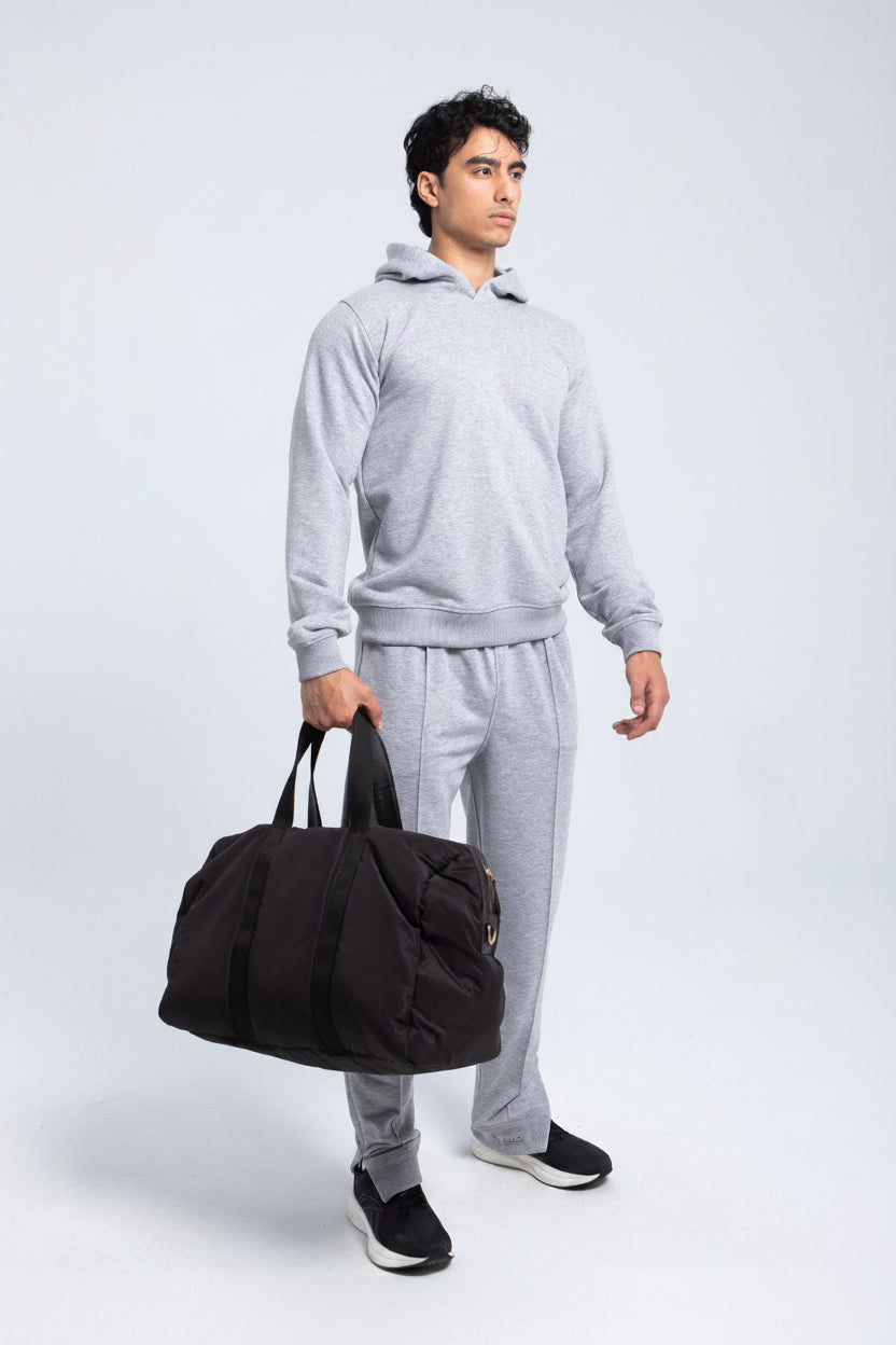 Full body look wearing heather grey fleece hoodie