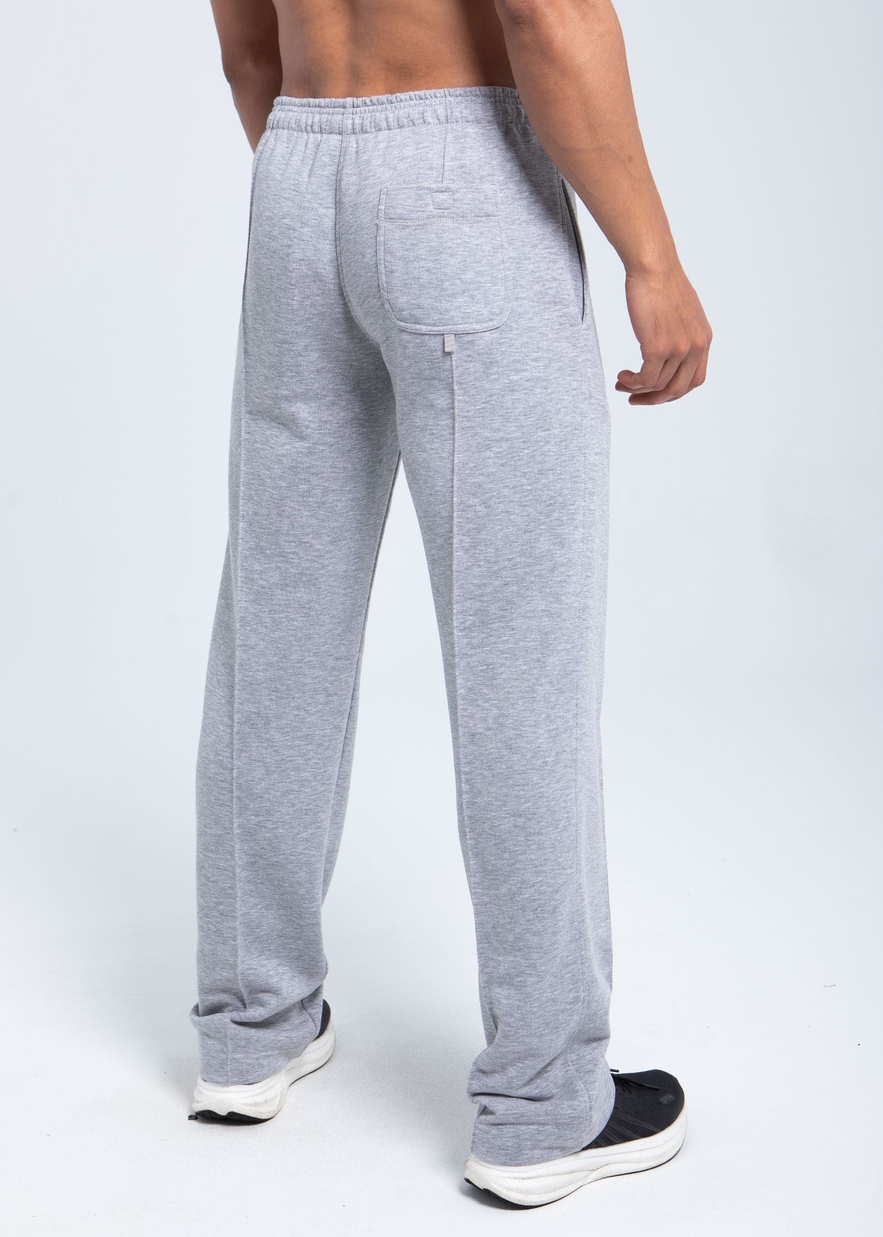 Back view of fleece pants with patch pocket and clean branding