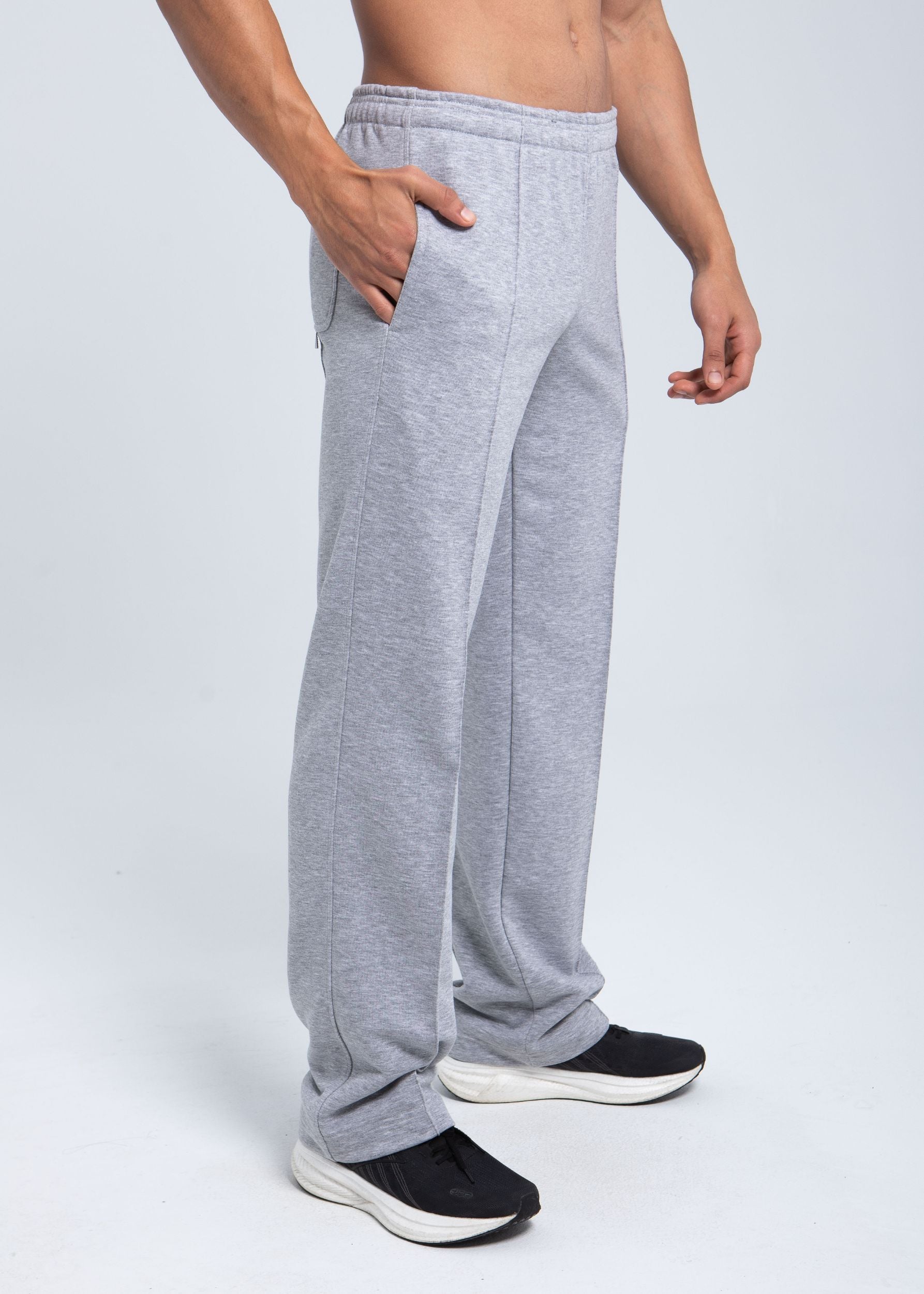 Angled side view of pleated fleece pants with elastic waistband
