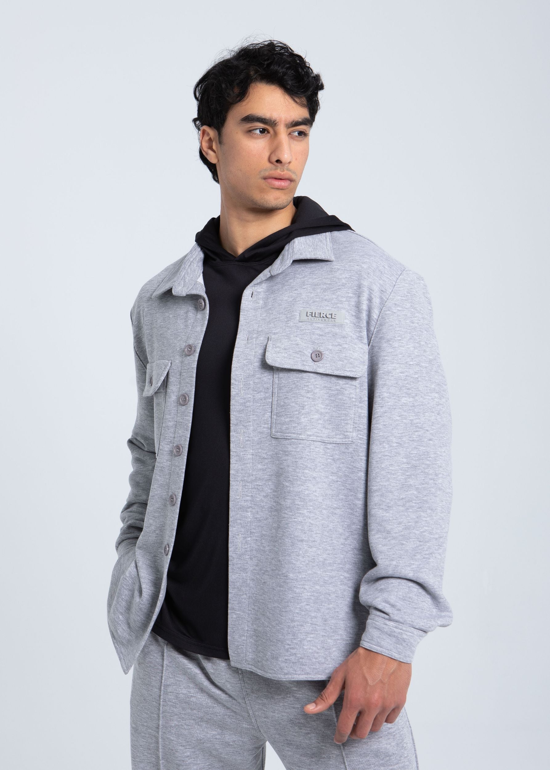 Essential fleece overshirt angled view showing button-front design