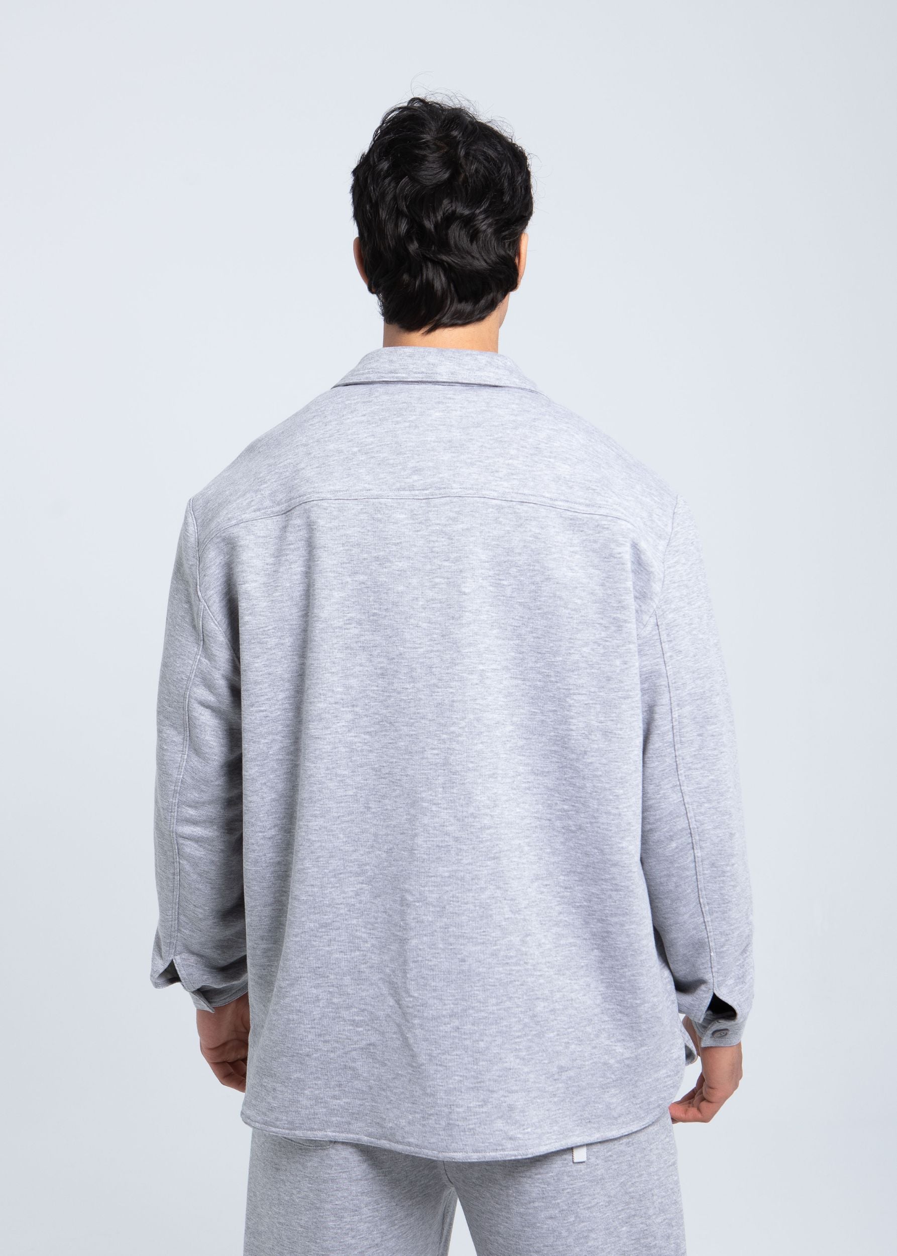 Back view of essential fleece overshirt showing clean structure