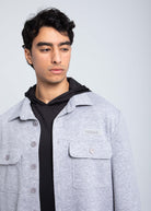 Close-up of fleece overshirt chest pocket with FIERCE logo patch