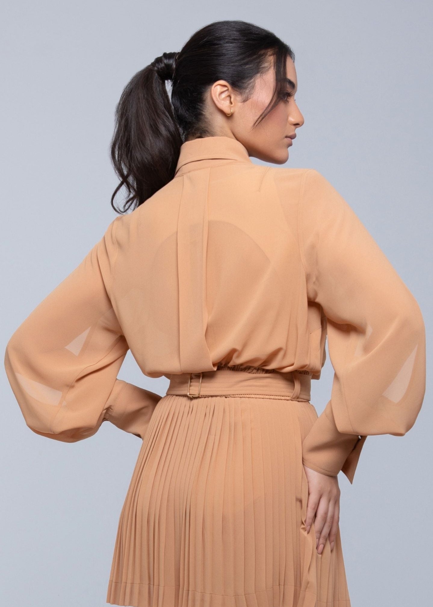 Sheer Jacket with button front, sleeve slits, and gold-accented belt